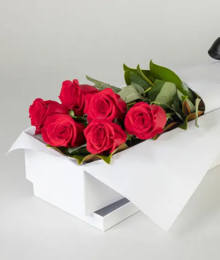 half dozen red roses in gift box